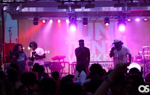 A local performer performing on stage in front if crowd