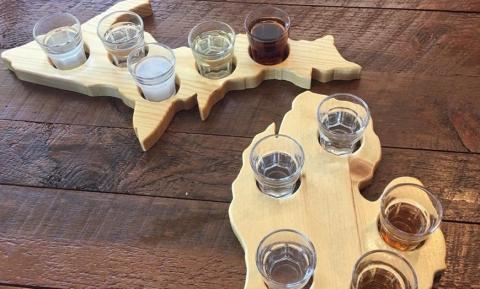 flight of whiskey on a Michigan shaped platter