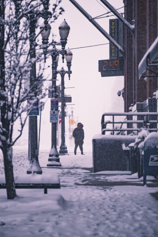 Person walking in snowy conditions