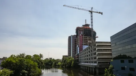 Construction of the new Tower on Grand, showing a construction crane in the air.