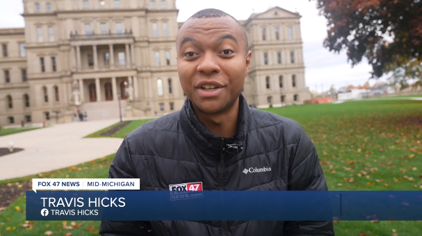 Reporter in front of capitol