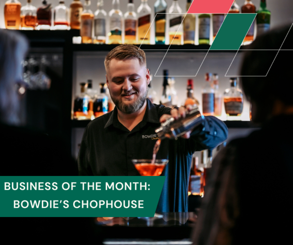 A bartender pours a drink for two customers at Bowdie's Chophouse